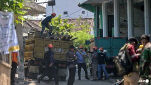 Death toll rises to 13 as rescuers search for trapped Indonesian students