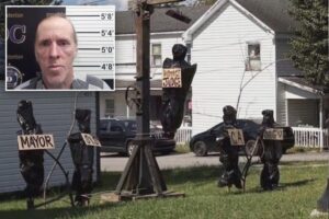 Twisted Halloween display shows local officials in body bags