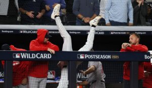 Yankees’ Ryan McMahon flips over railing to preserve rookie Cam Schlittler’s historic gem, knock out Red Sox