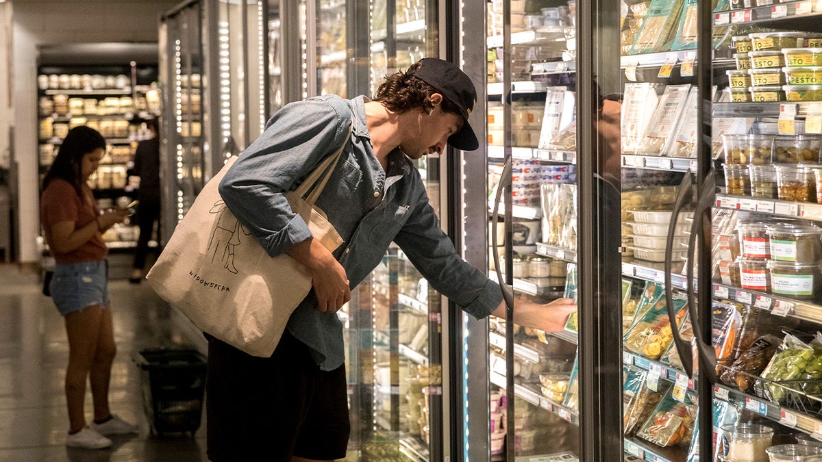 Man grocery shopping