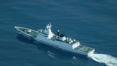 China holds National Day ceremony in waters off atoll claimed by Philippines