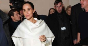 Meghan Markle Quietly Attends Paris Fashion Week in Winter-White Pantsuit