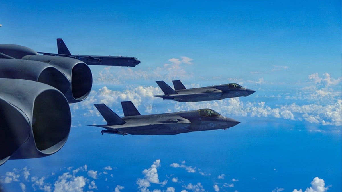 A U.S. Air Force B-52H Stratofortress bomber assigned to the 2nd Bomb Wing, integrates with a U.S. Marine Corps F-35B Lightning II aircraft assigned to the Marine Fighter Attack Squadron 225, in the U.S. Southern Command area of responsibility, Oct. 15, 2025.