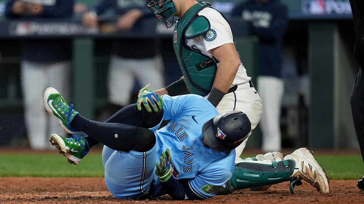 George Springer falls after being hit by a pitch