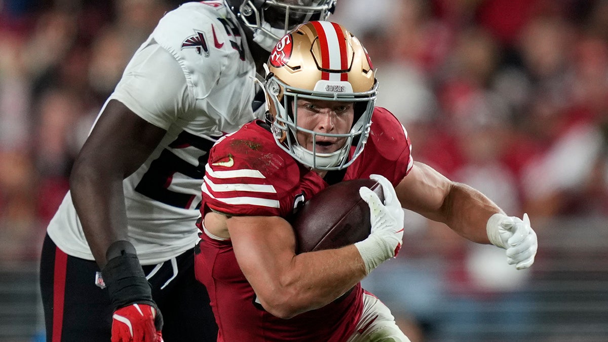 Christian McCaffrey runs on field