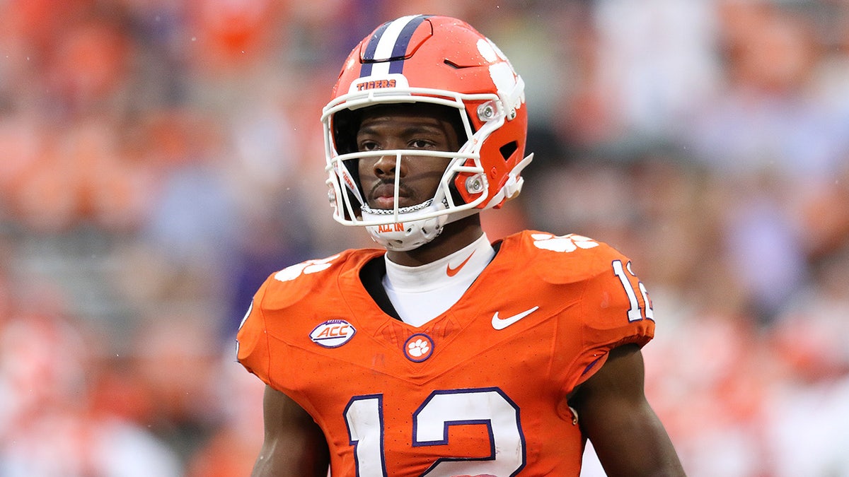 Bryant Wesco Jr stands on the football field