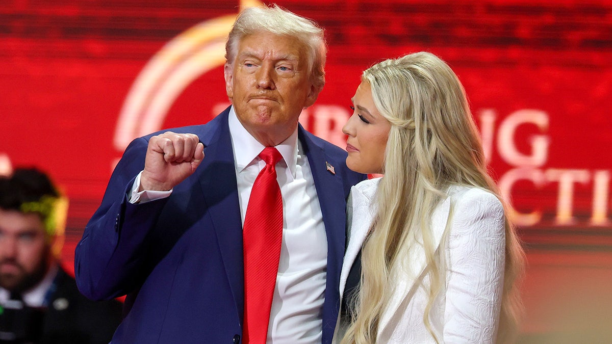 Erika Kirk and Donald Trump on stage in Arizona