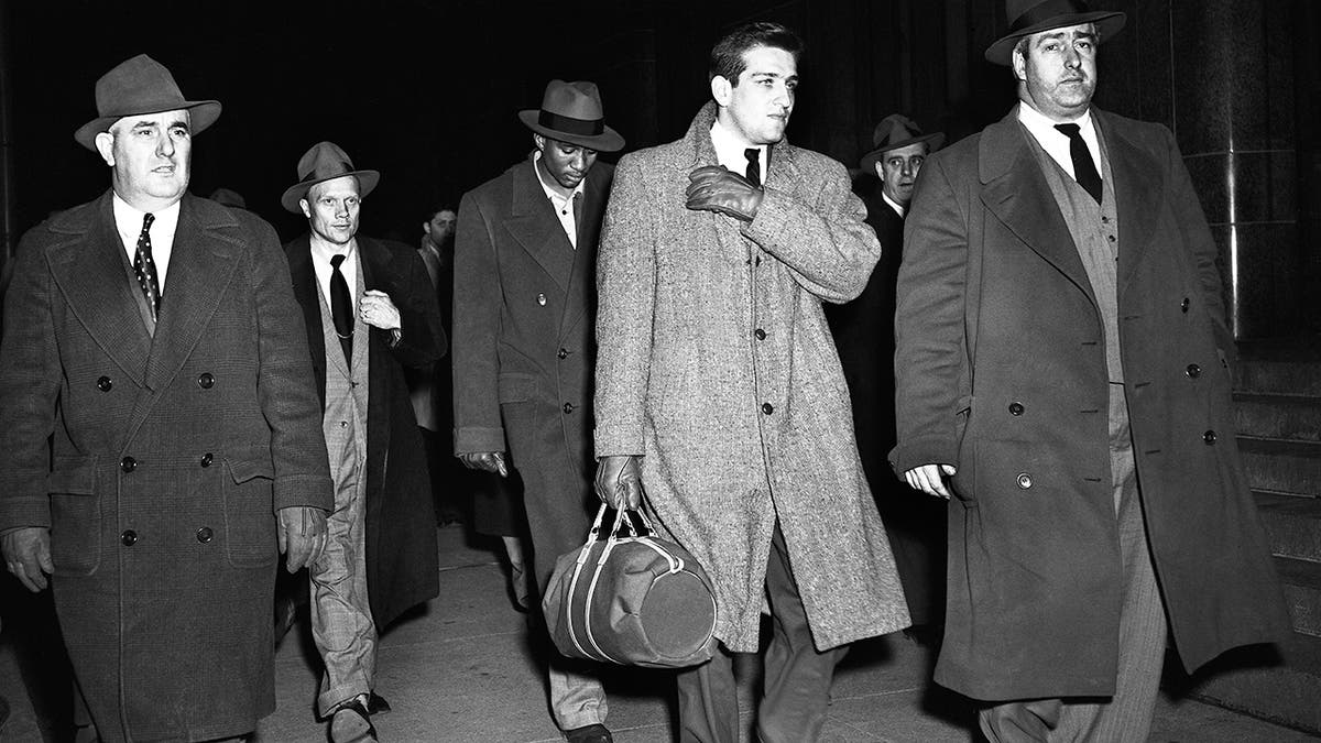 Al Roth and Ed Warner walked by detectives