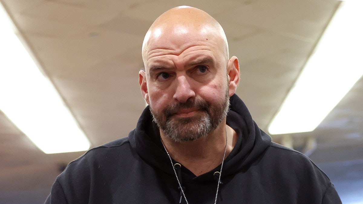 John Fetterman speaks to reporters