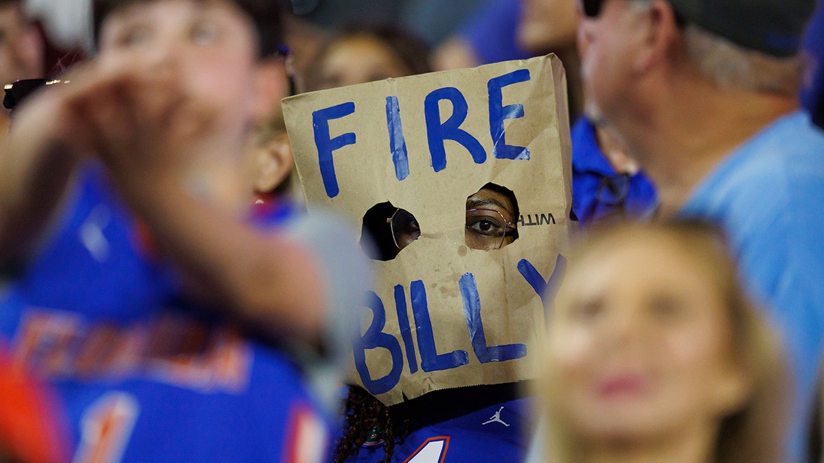 A Florida fan as a poignant "Fire Billy" message on a paper bag