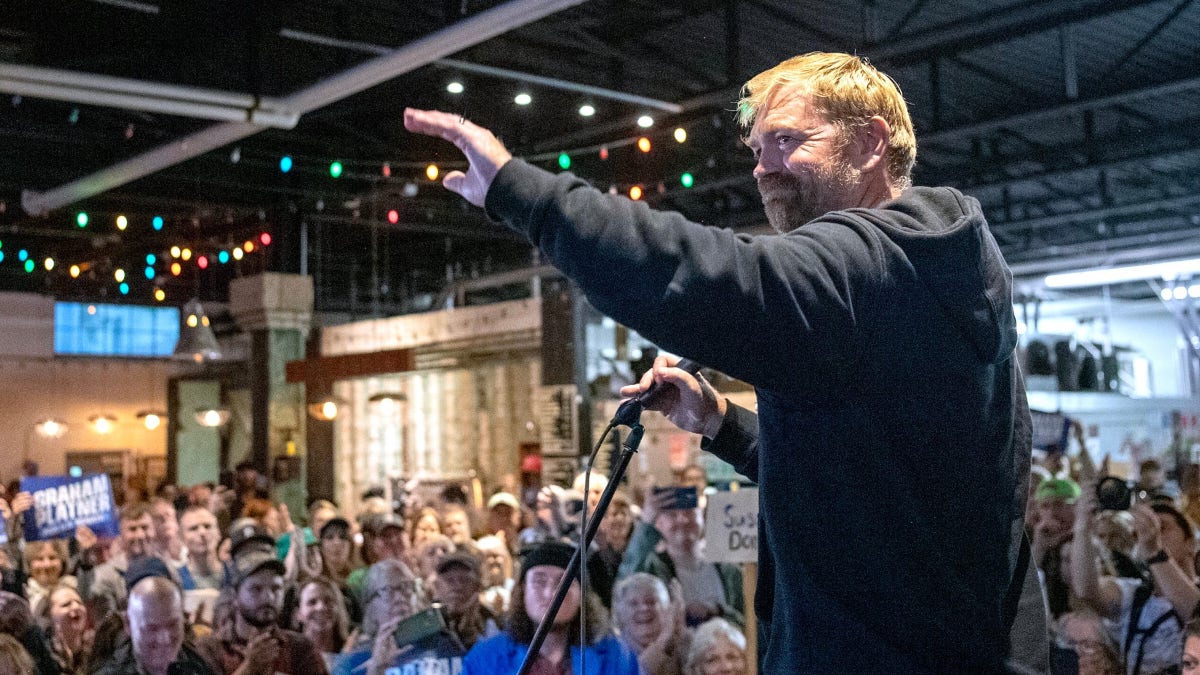 U.S. Senate candidate Graham Platner, D-Maine, acknowledges a large crowd in Portland, Me.