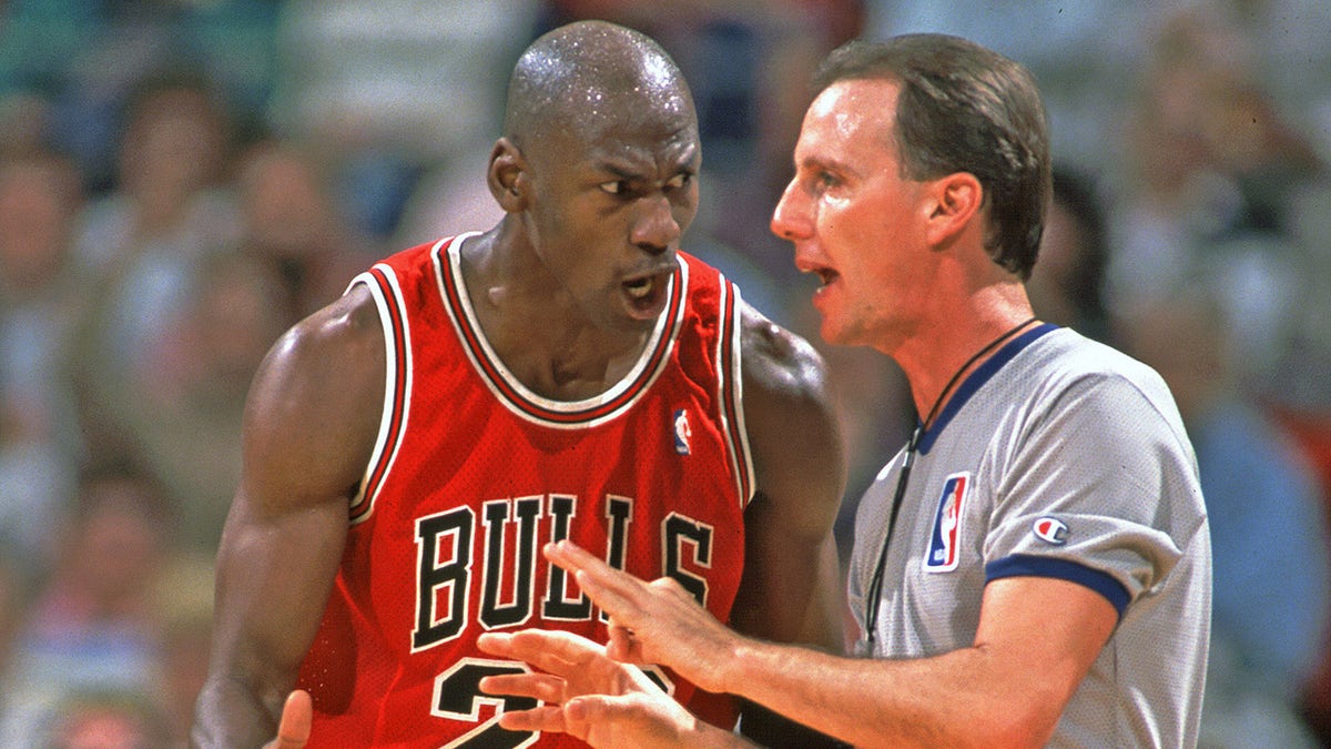 Michael Jordan talks to a ref