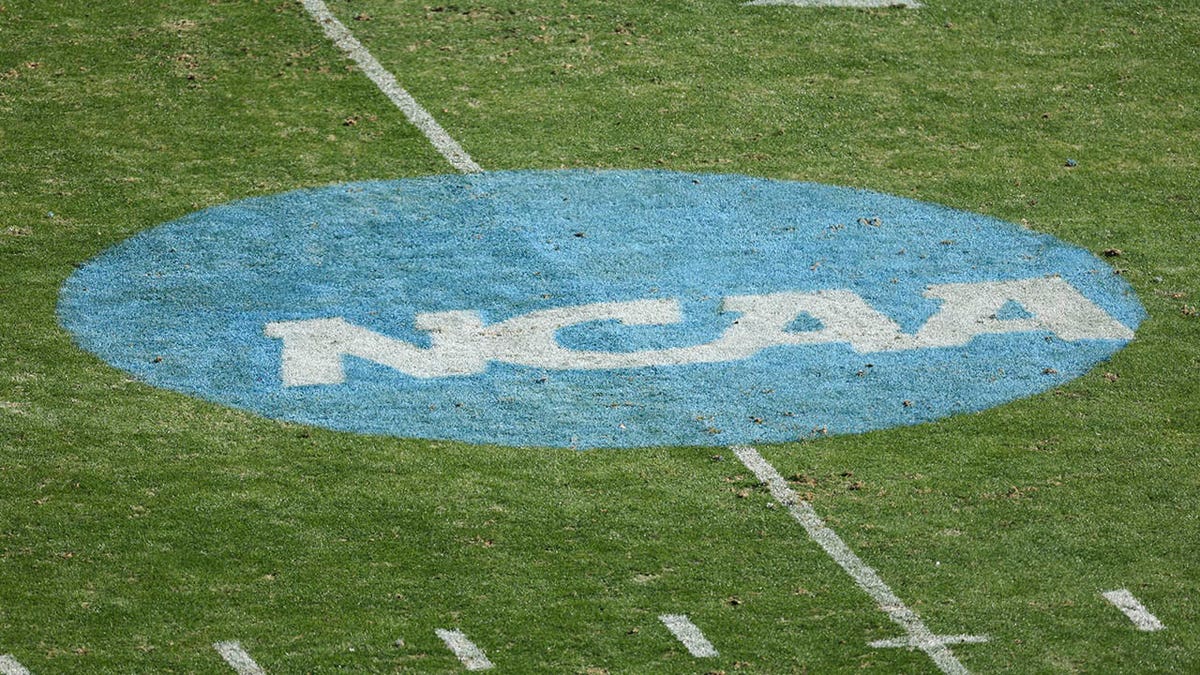 NCAA logo on a football field