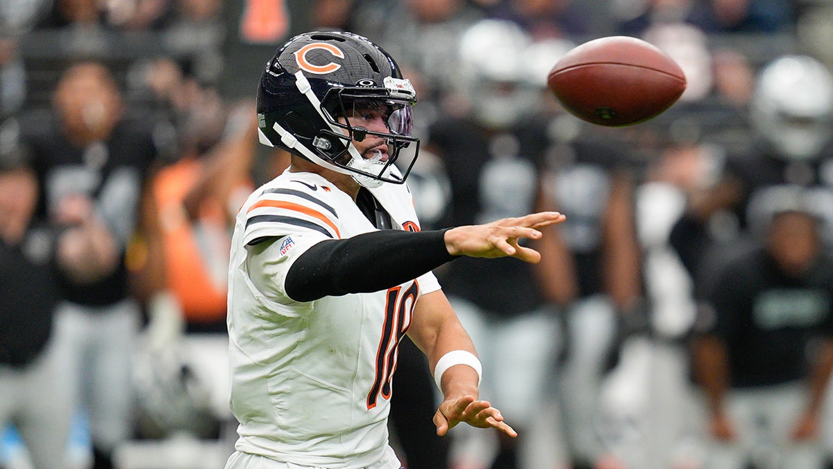Caleb Williams throws the ball