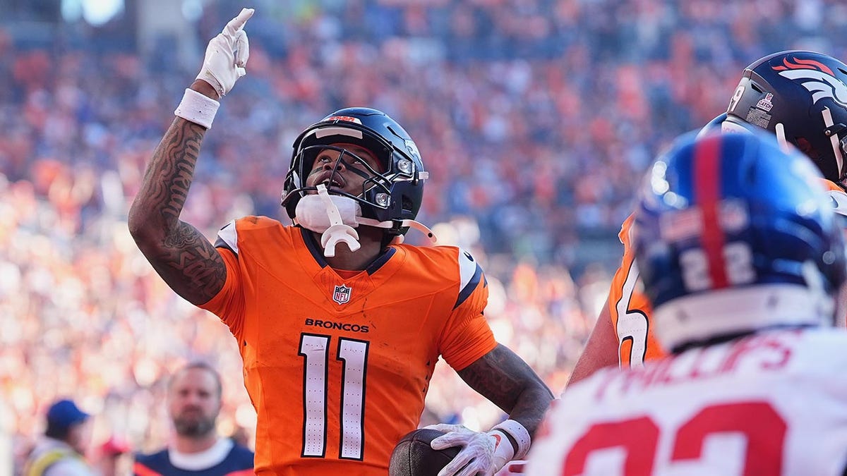 Troy Franklin celebrates a touchdown