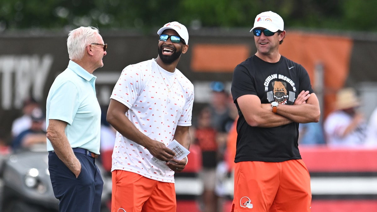 Andrew Berry chuckles with Browns execs