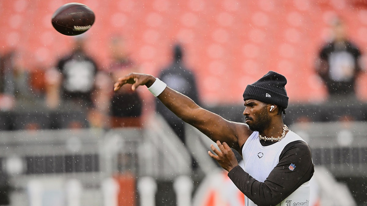 Shedeur Sanders warms up before a game against the Miami Dolphins