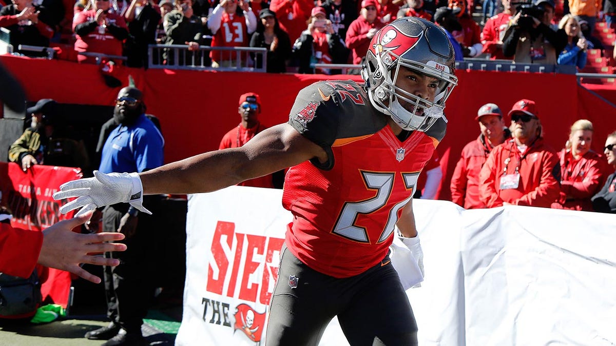 Doug Martin runs onto the field