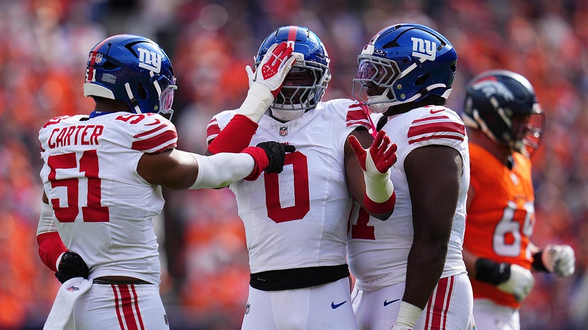 Brian Burns celebrates with his teammates