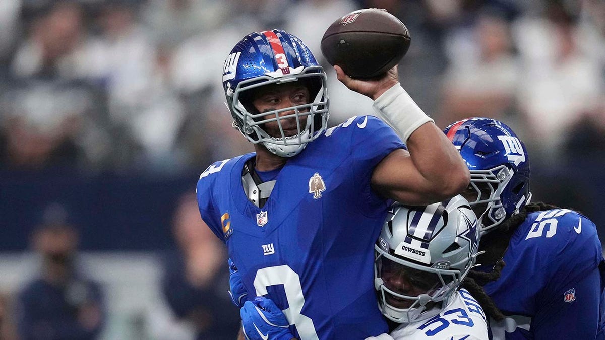 Russell Wilson attempts to throw