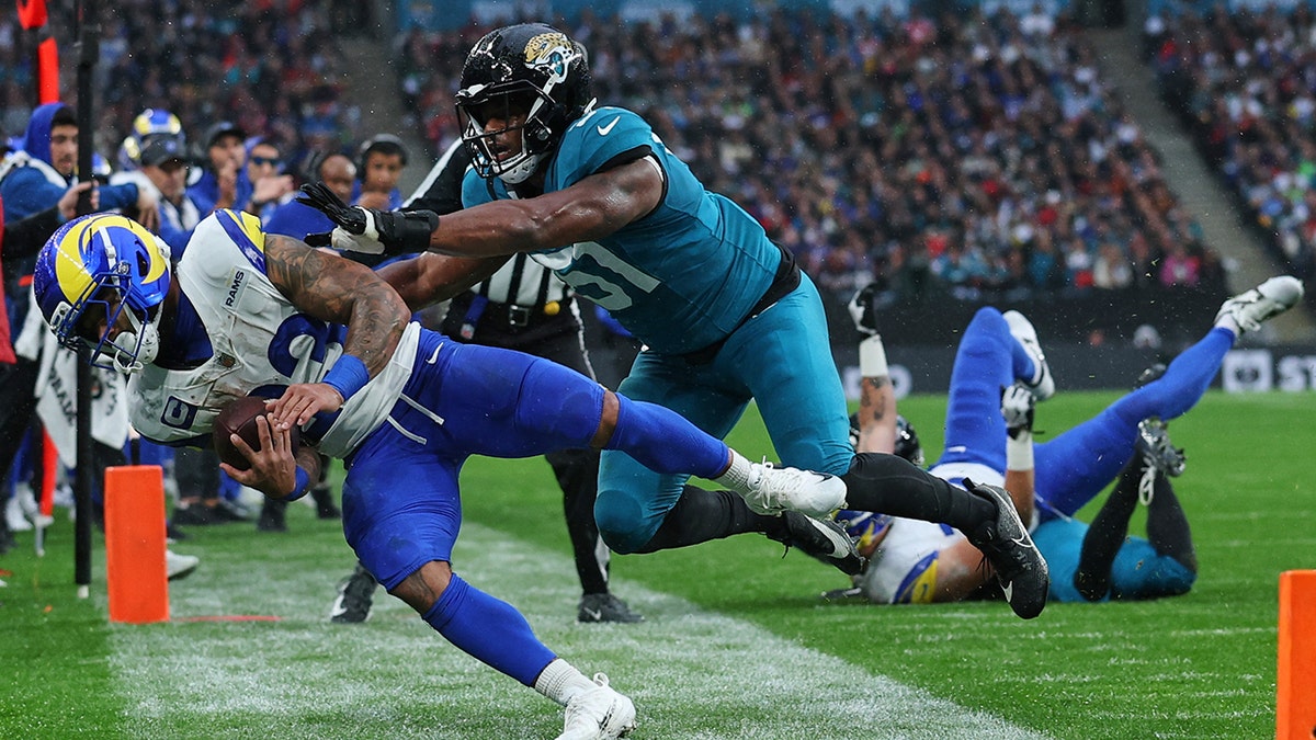 Kyren Williams is pushed out of bounds