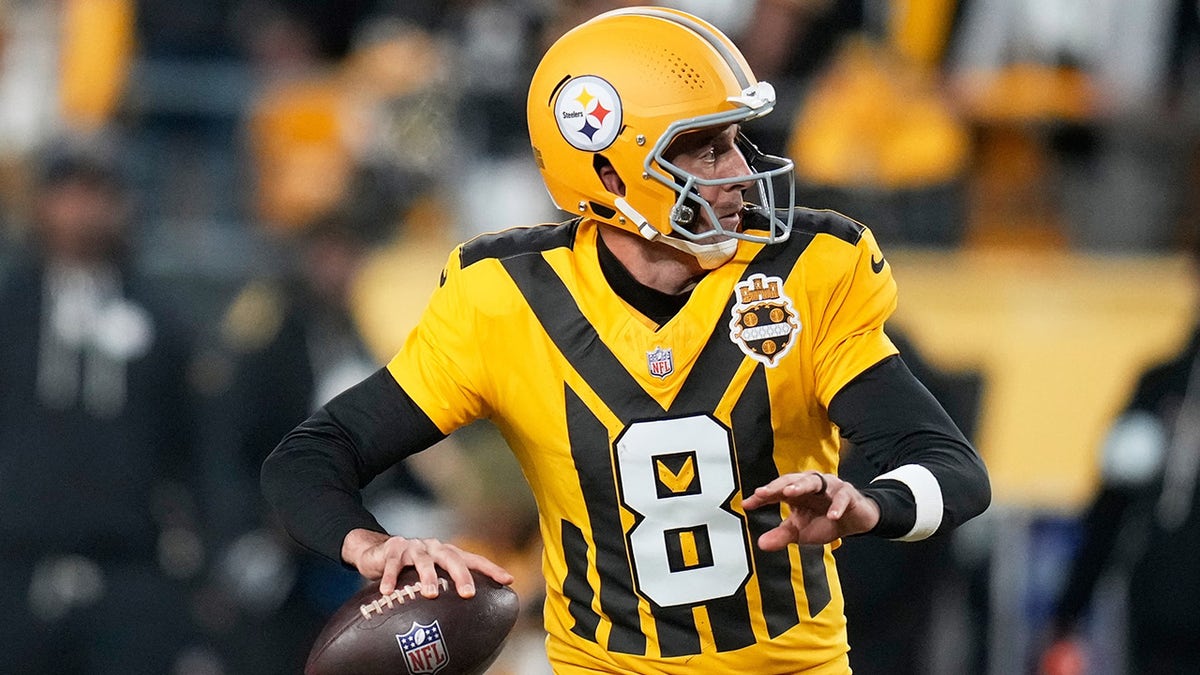 Aaron Rodgers looks to throw