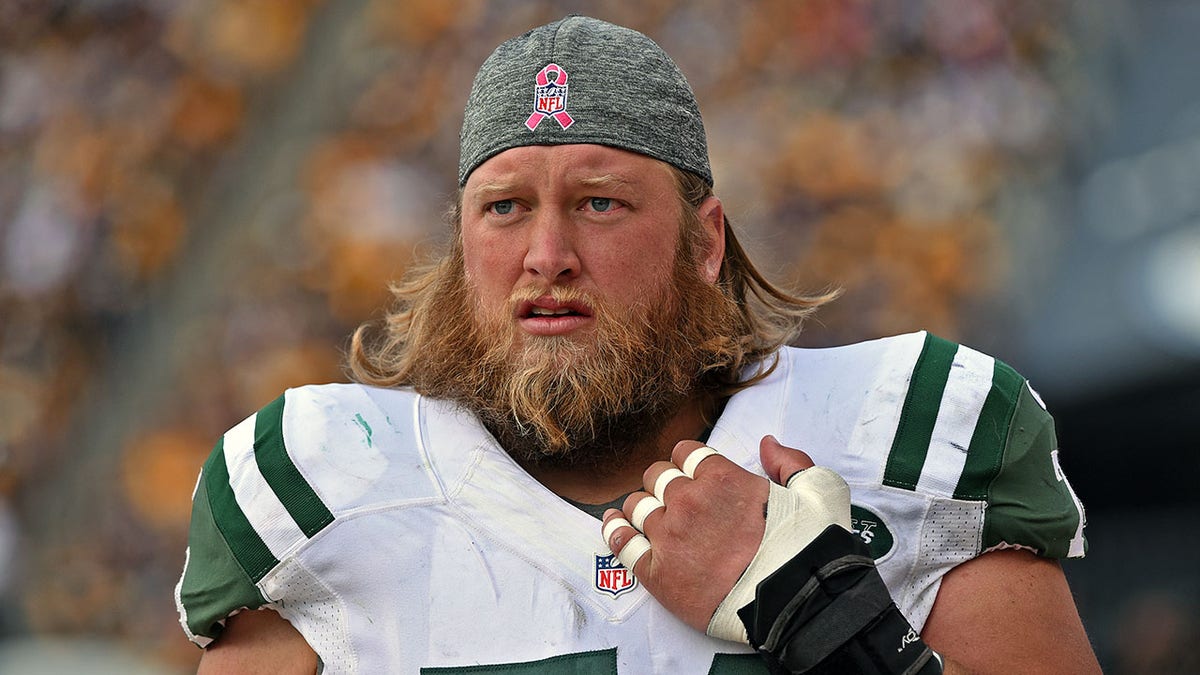 Nick Mangold looks on field