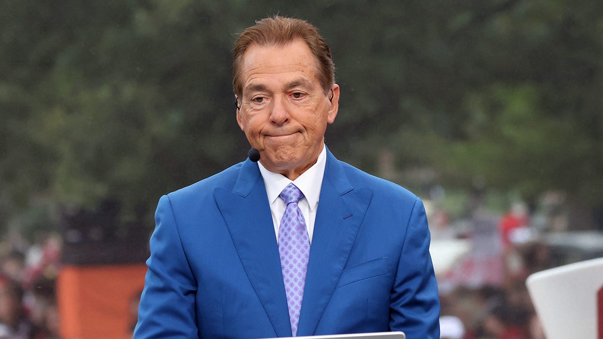 Nick Saban looks on