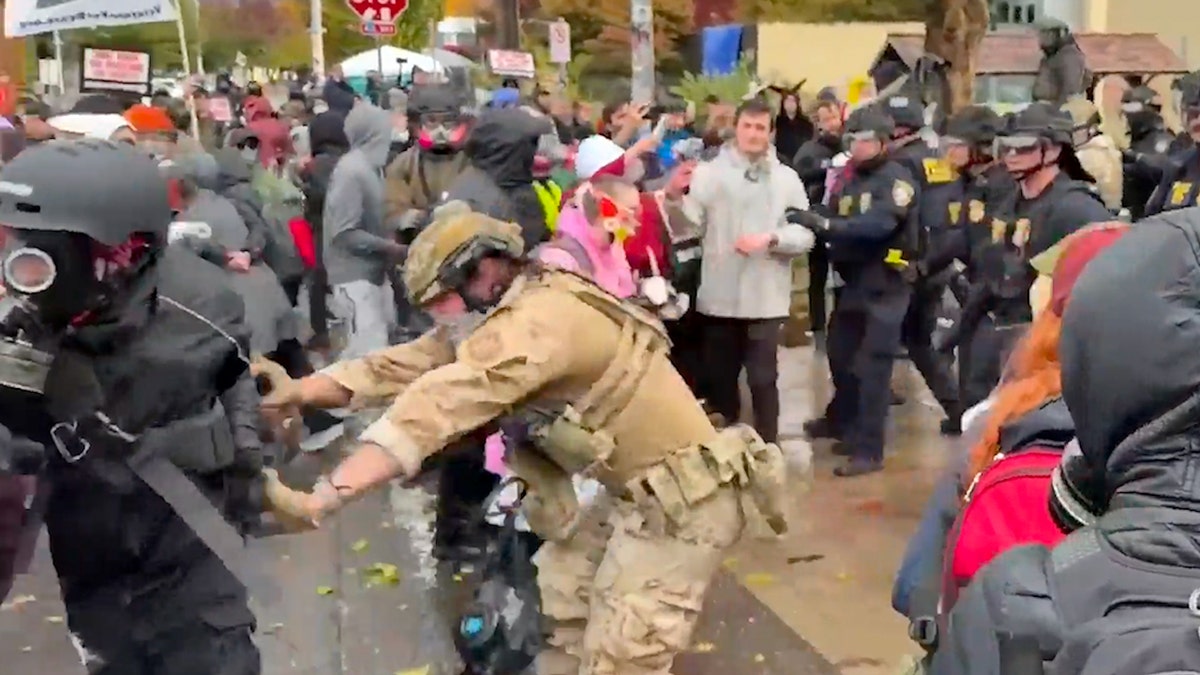 Federal agents and protesters clash outside an ICE facility in Portland