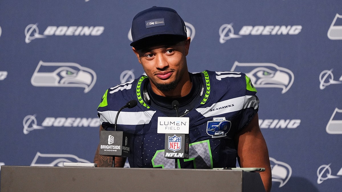 Jaxon Smith-Njigba speaks to the media