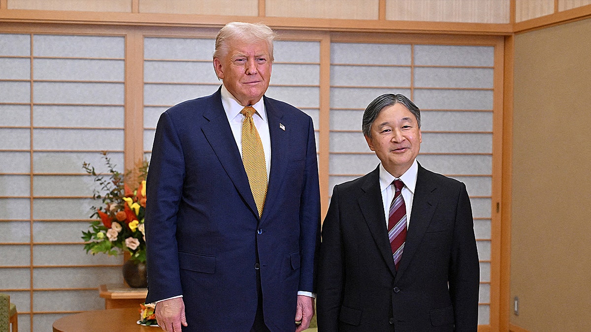 Trump and Emperor Naruhito smile