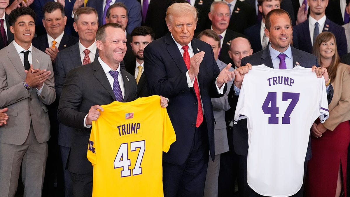 Jay Johnson and Brad Neffendor pose with President Trump