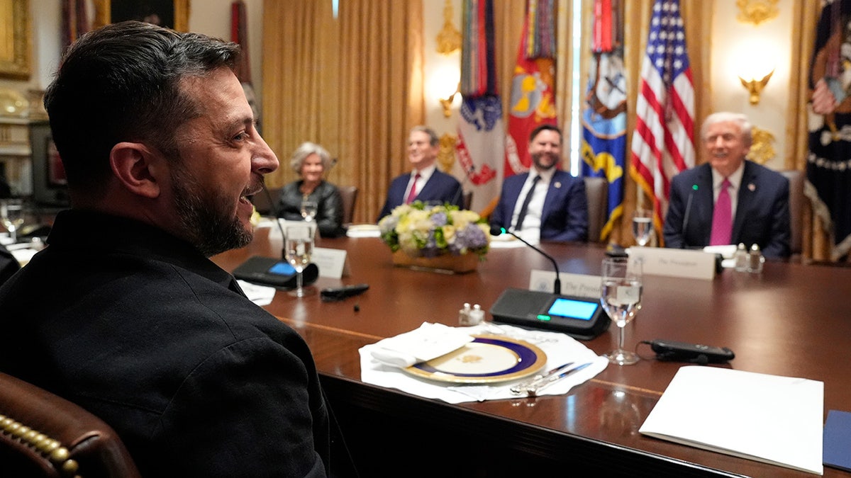 Zelenskyy sitting across a table from Trump at the White House