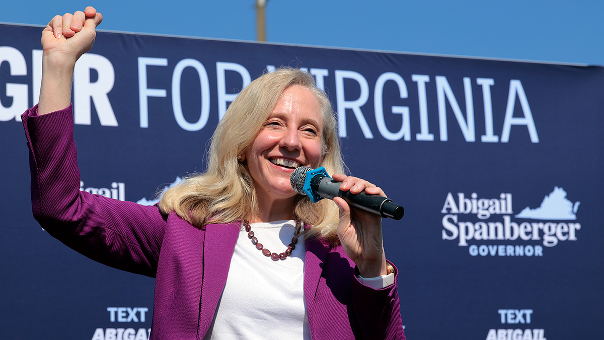Abigail Spanberger smiles and cheers