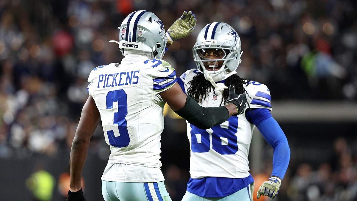 CeeDee Lamb and George Pickens smile on field