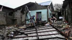 Philippines digs out from Typhoon Fung-wong as death toll climbs to 18