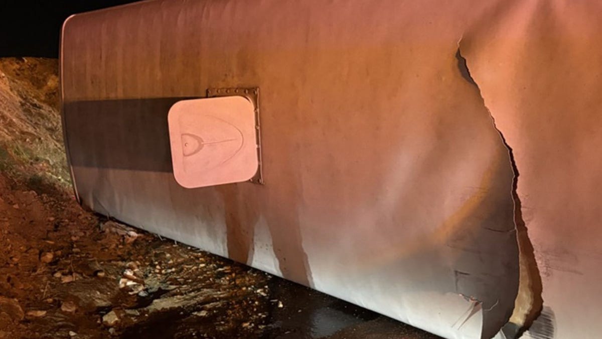 The top of an overturned bus