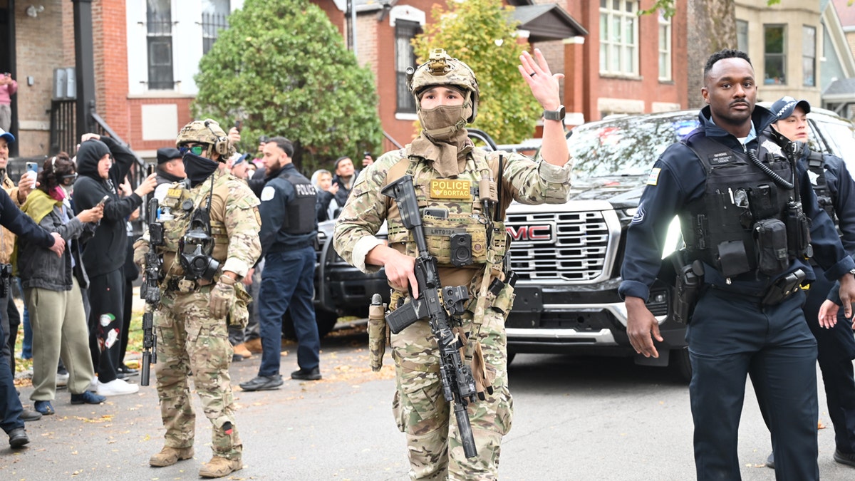 Agents and police in Chicago's Little Village.