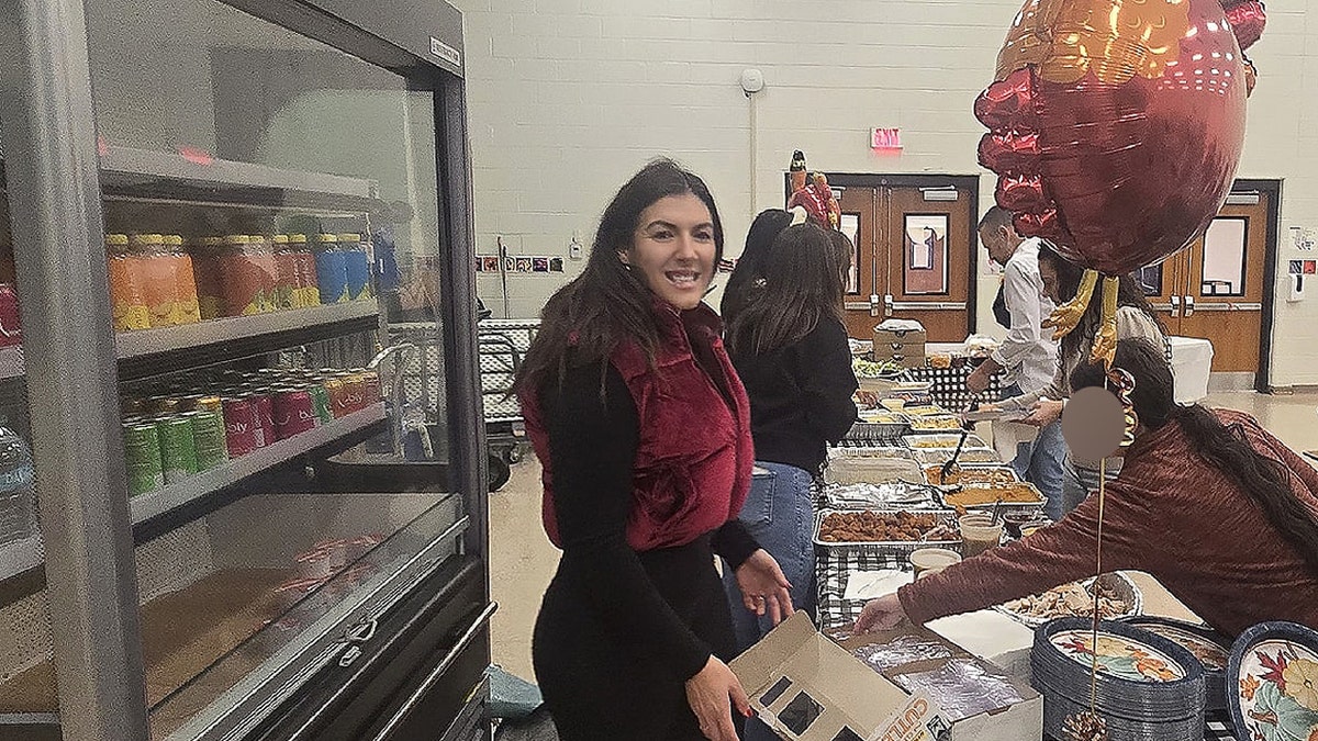 Danielle Bellomo hands out food