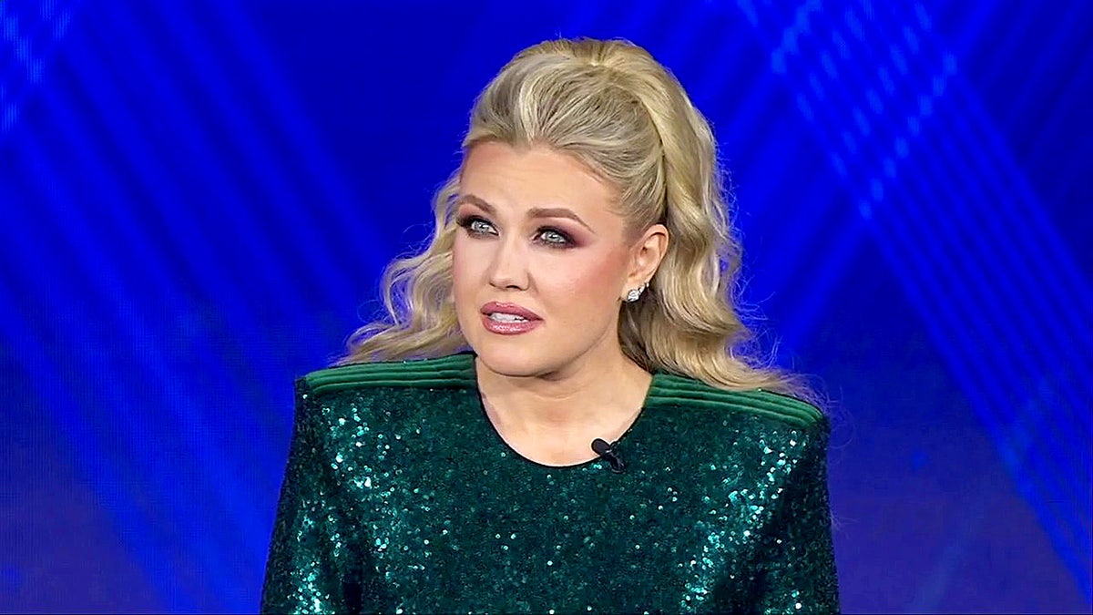 Erika Kirk stands on stage to accept the Charlie Kirk Legacy Award at the Fox Nation Patriot Awards.