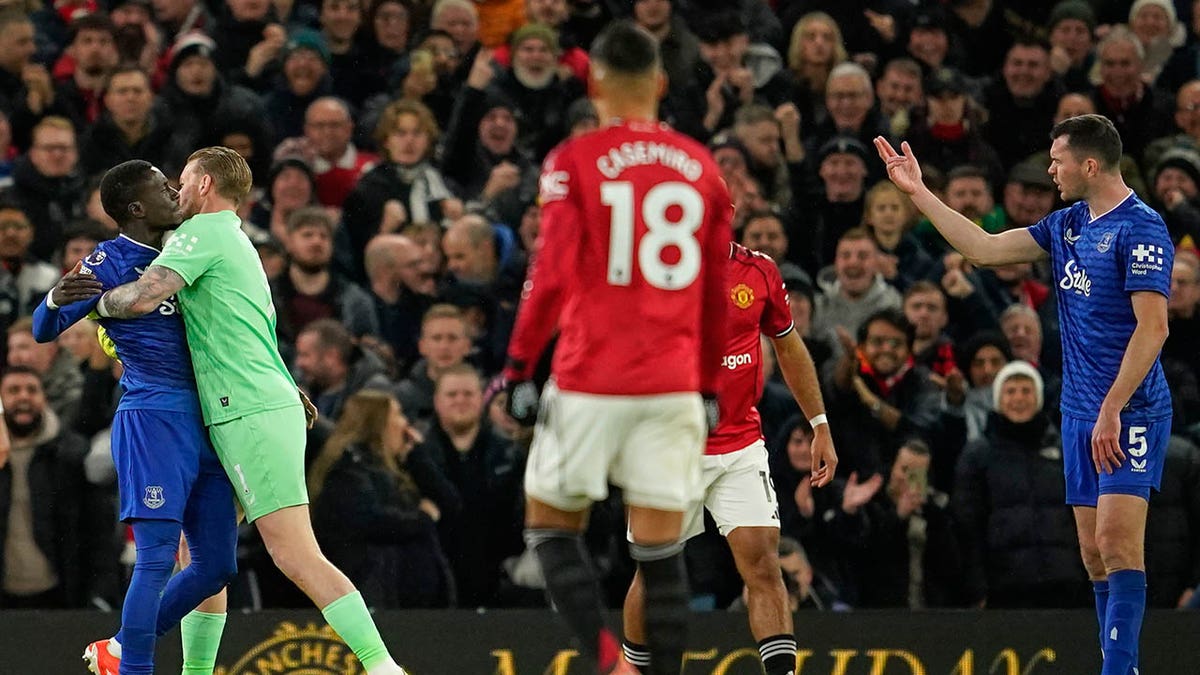 Michael Keane yells at his teammate