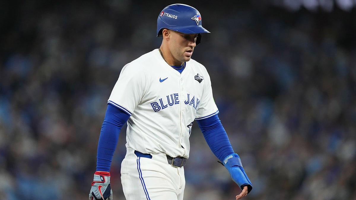 George Springer walks off the field