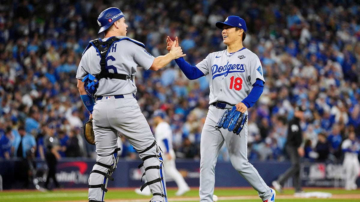 Will Smith and pitcher Yoshinobu Yamamoto in Game 7