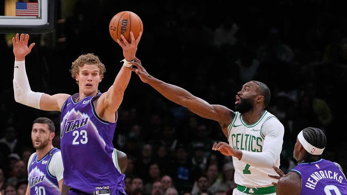 Jaylen Brown battles for a rebound