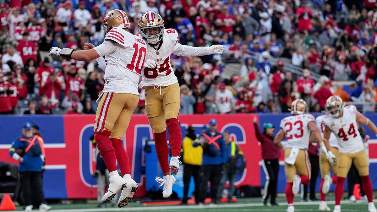Mac Jones celebrates a touchdown