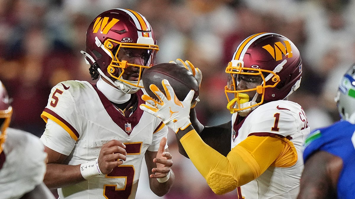 Deebo Samuel gets the ball from Jayden Daniels