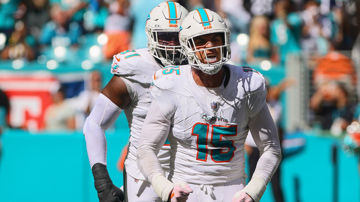 Jaelan Phillips celebrates a sack