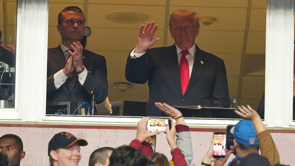 Donald Trump with Pete Hegseth at Northwest Stadium