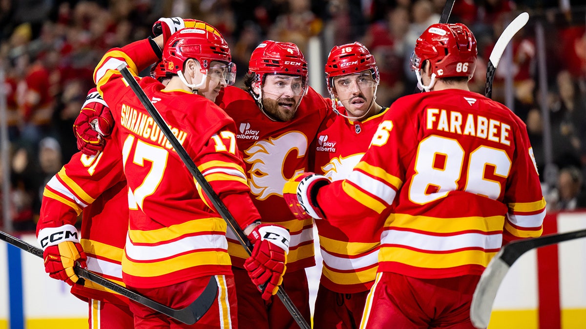 Flames players celebrate goal