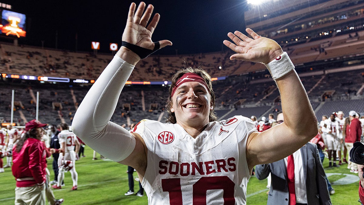 John Mateer waves to the crowd